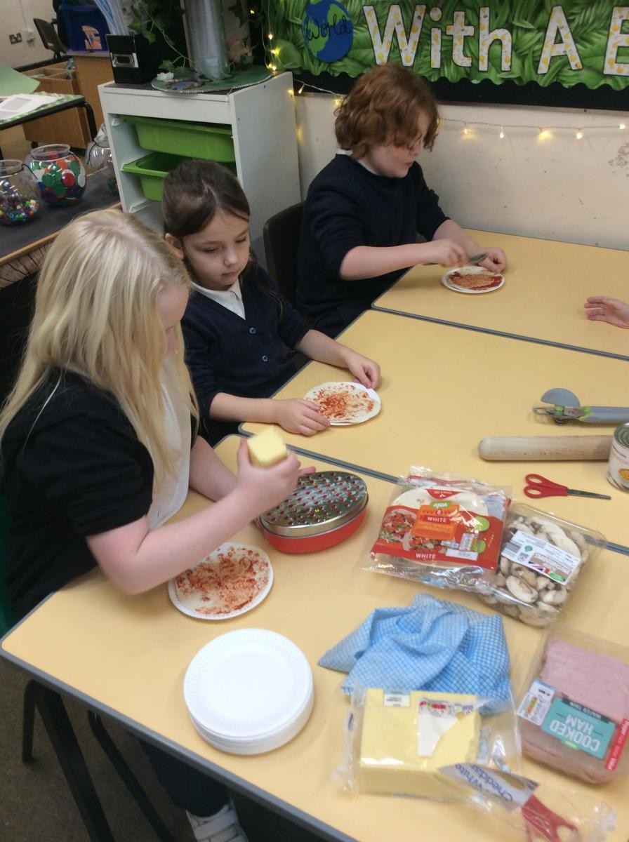 Year 1 & 2 making pizzas.