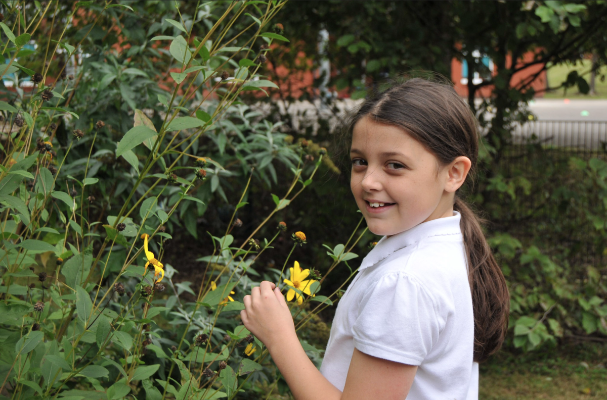 child holding flower