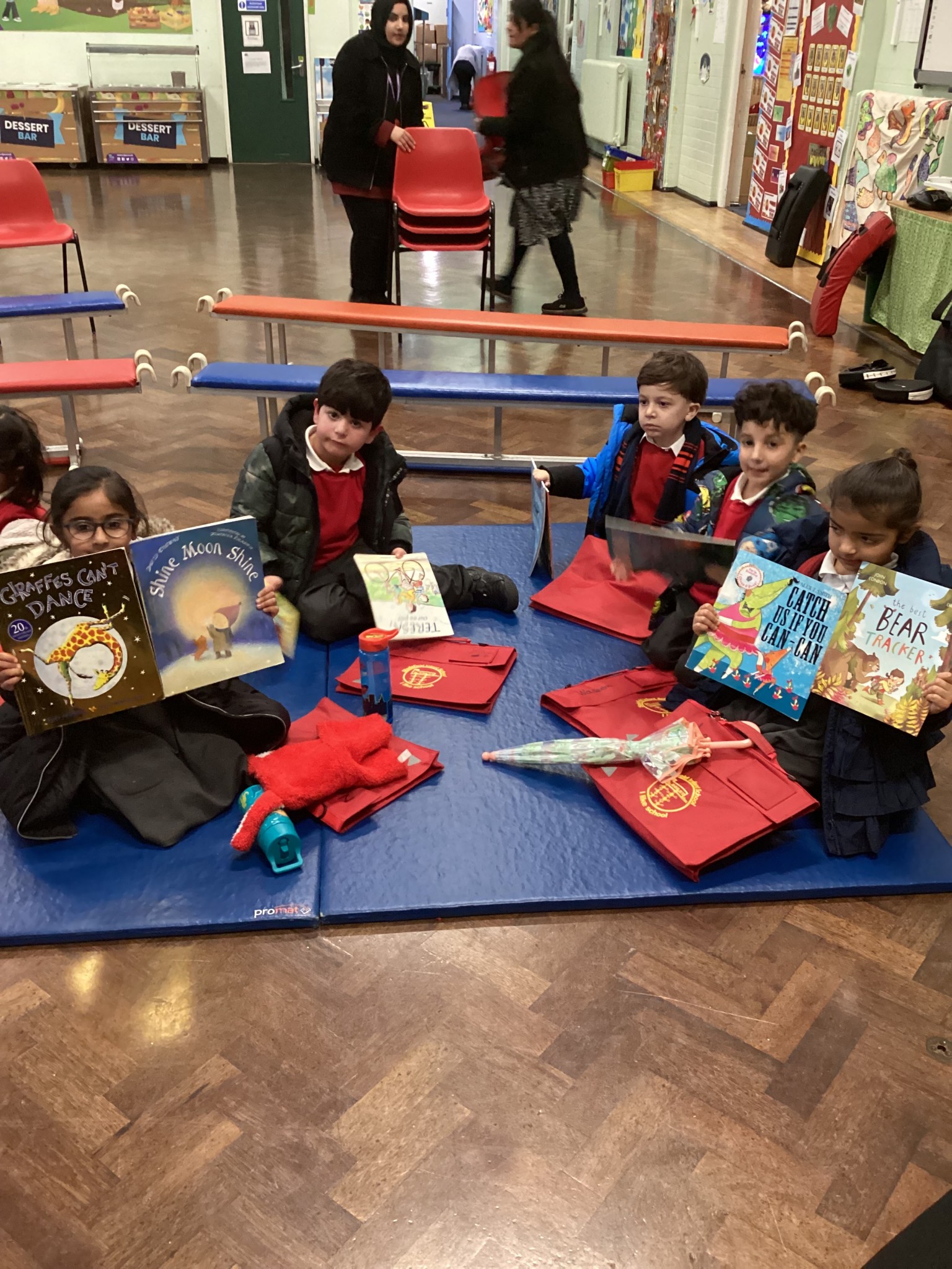 These children are happy to recieve their new books!