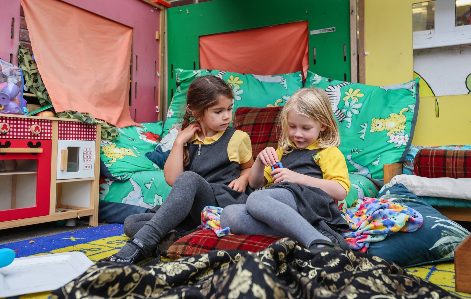 Pupils in the cosy corner of their classroom