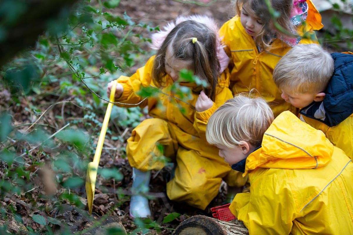 children wearing yellow rain suits