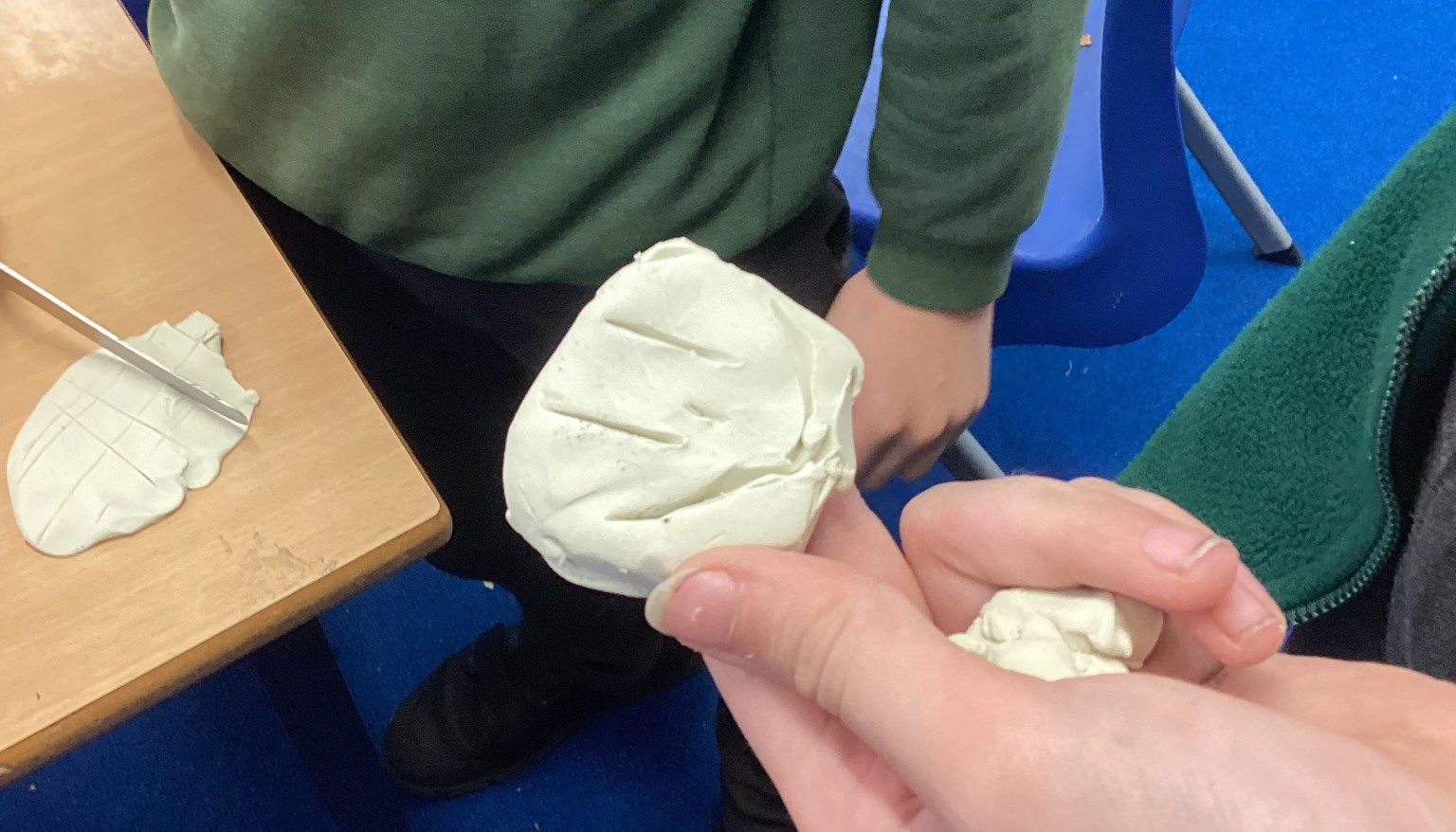 Exploring patterns with clay tools.