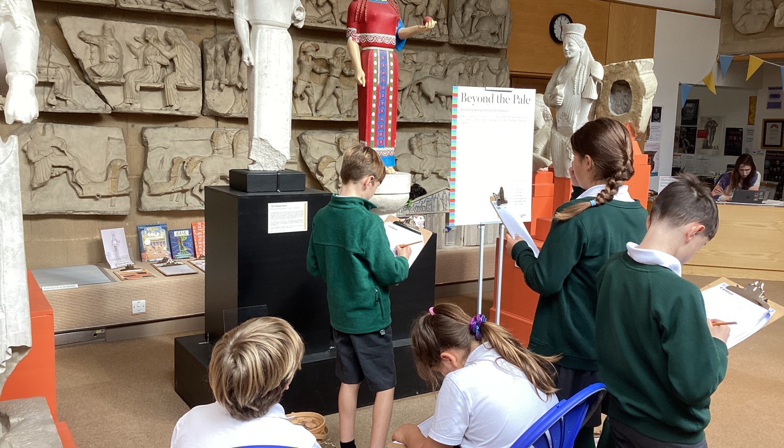 Taking time to study the statues and answering questions on what they depict.