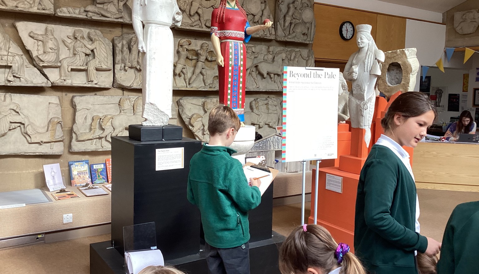 Taking time to study the statues and answering questions on what they depict.