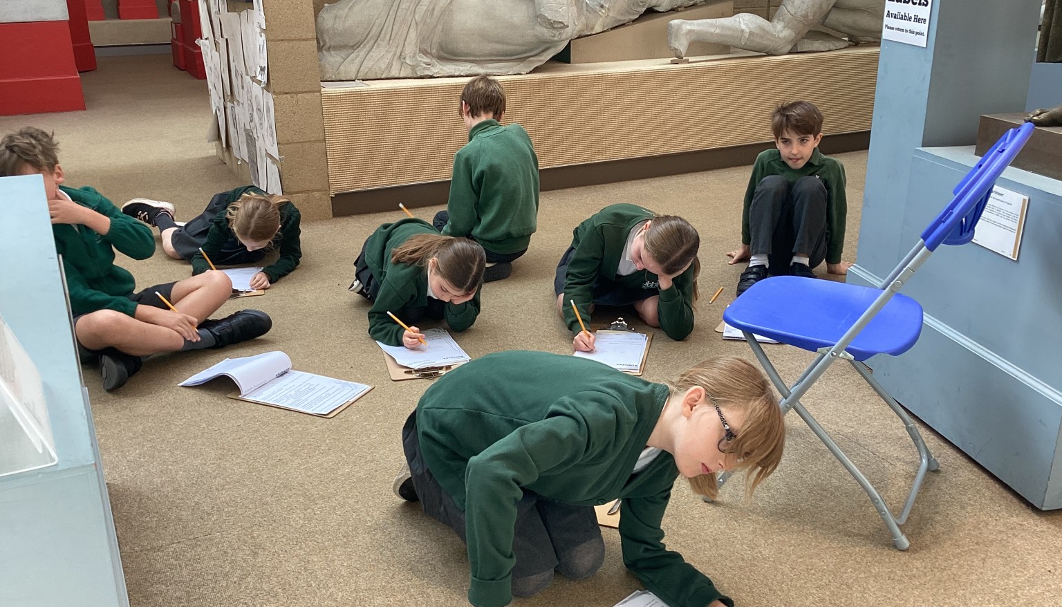 Taking time to study the statues and answering questions on what they depict.