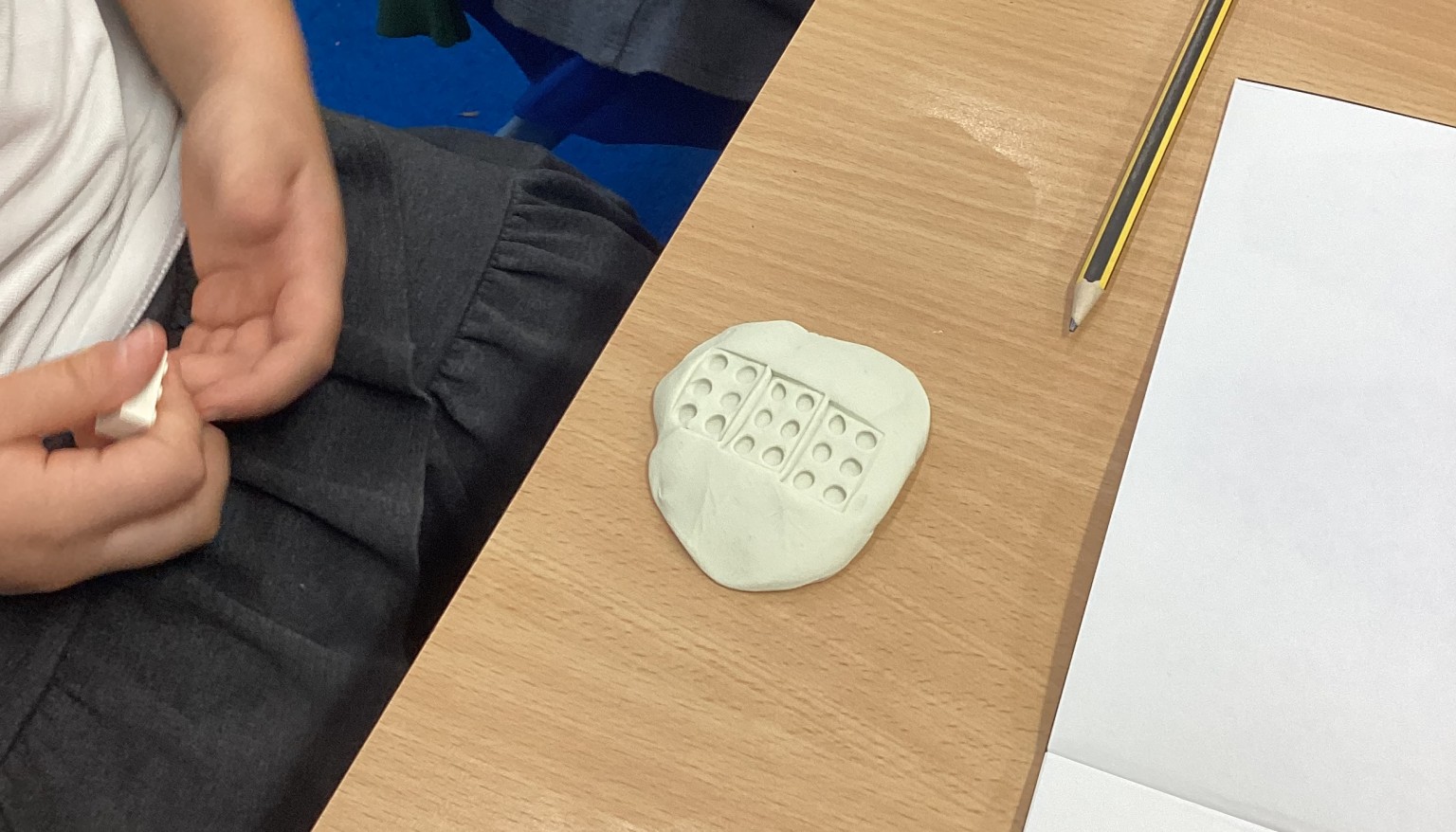 Exploring patterns with clay tools.