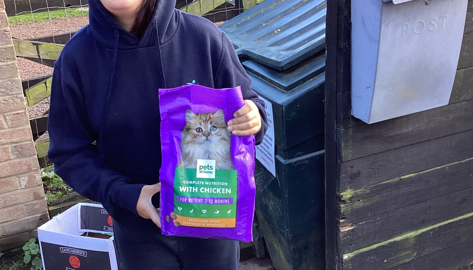 Donating food to feed the animals at the Hilltop Farm Sanctuary.