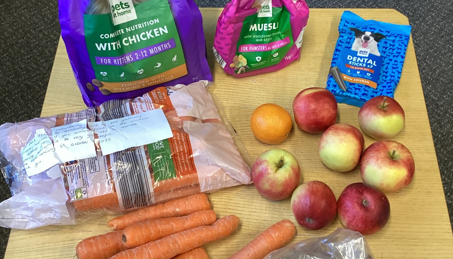 Donating food to feed the animals at the Hilltop Farm Sanctuary.