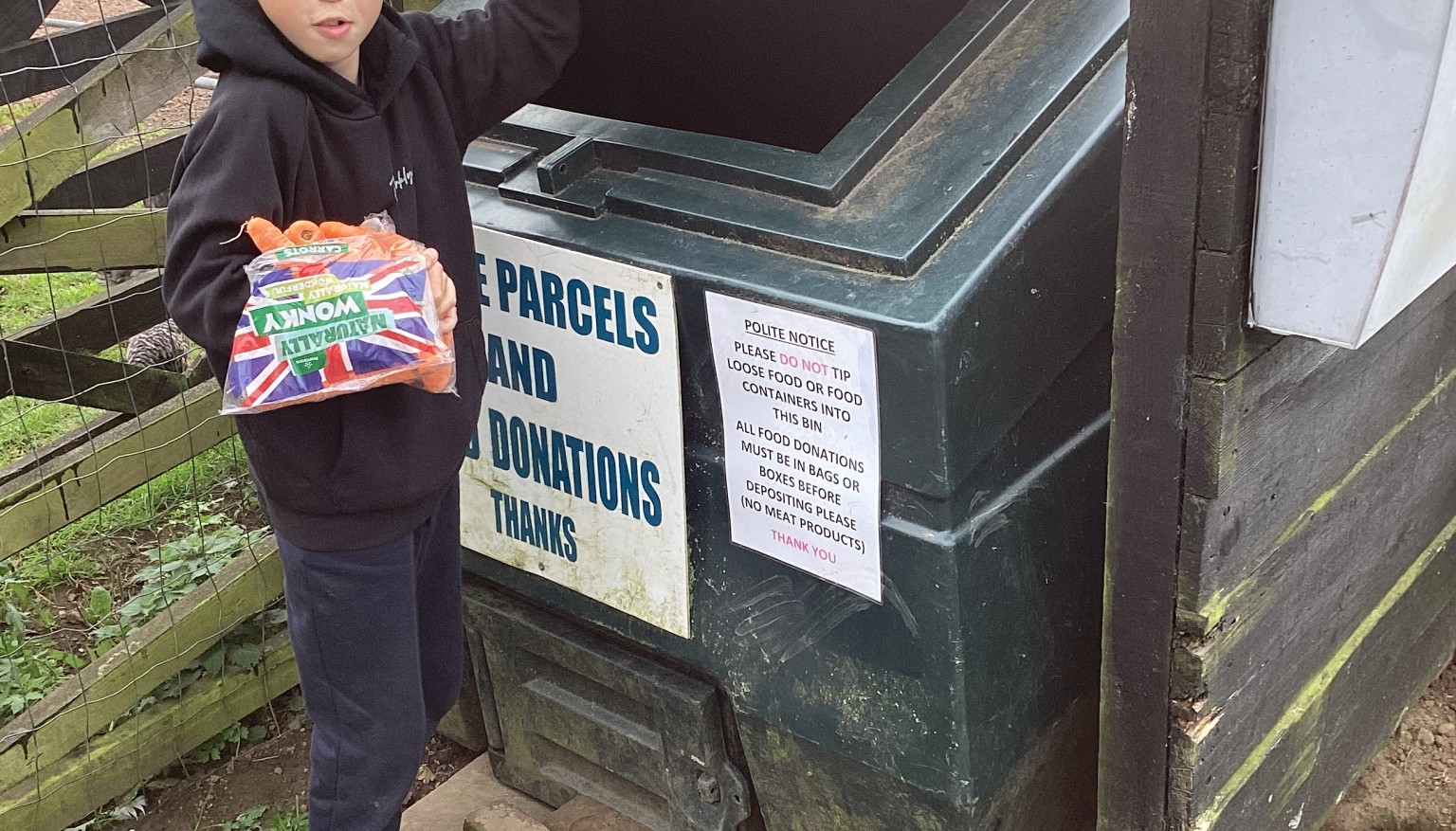 Donating food to feed the animals at the Hilltop Farm Sanctuary.