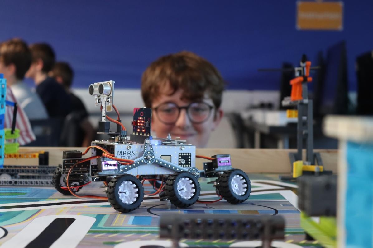 Pupil looking at scale model of M.A.R.S. Rover