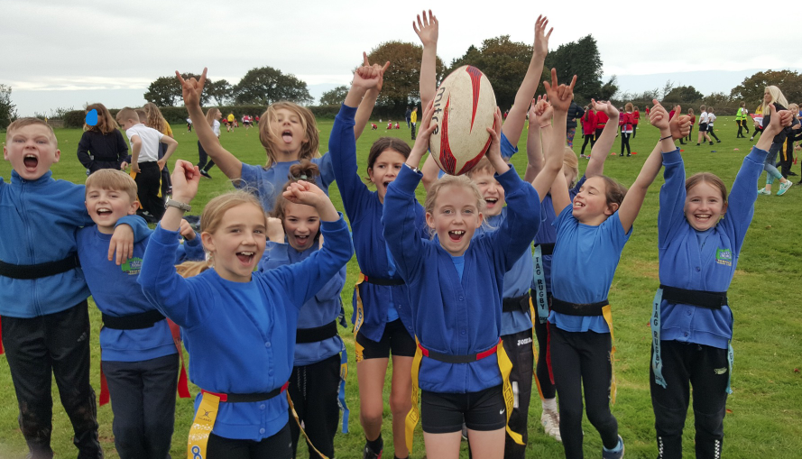 Children waving arms in the air