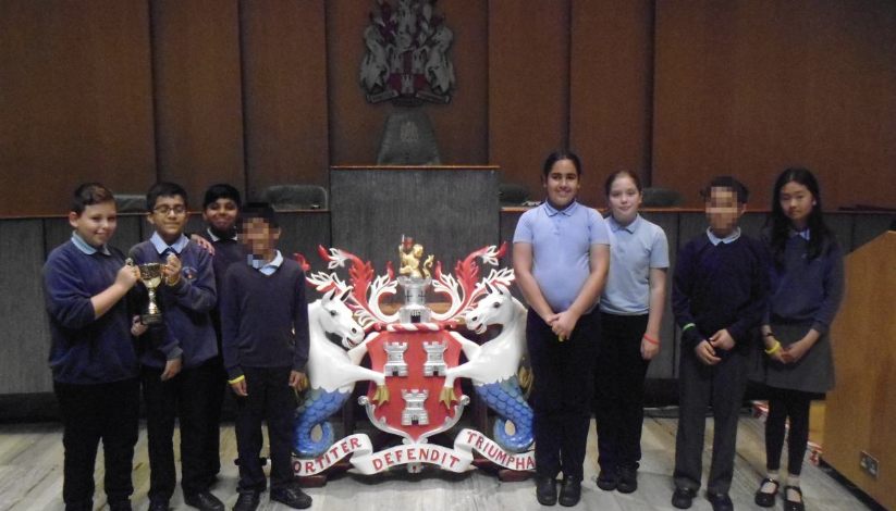 Children stood for photo holding trophy 